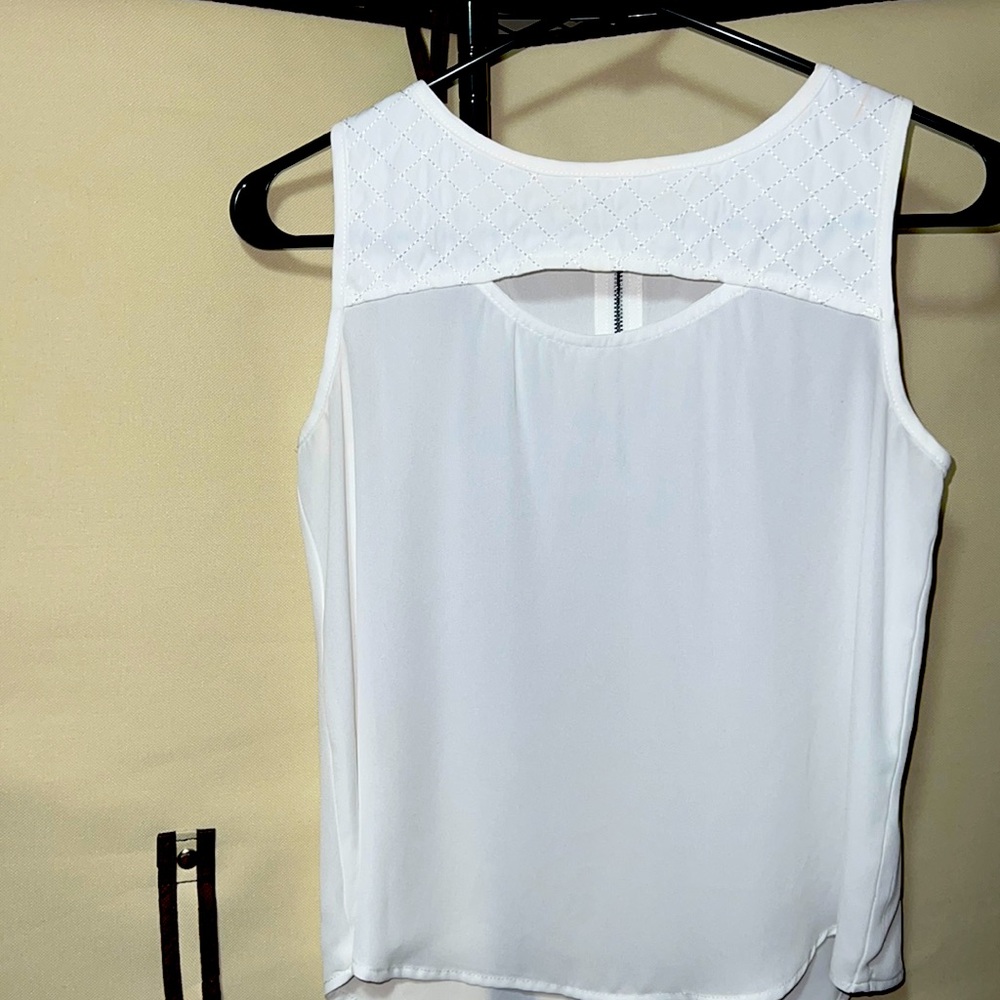 White sleeveless top